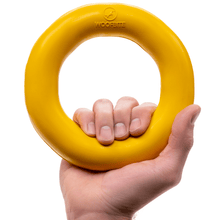 Durable yellow Power Ring dog toy made of industrial-strength rubber for aggressive chewers